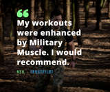 a man running through trees wearing a weighted vest and military uniform trousers