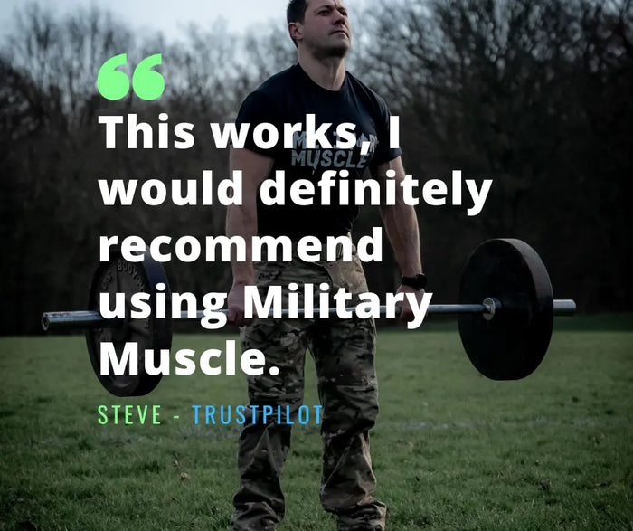 a man on a field performing a deadlift wearing military uniform trousers and a black military muscle tee shirt.